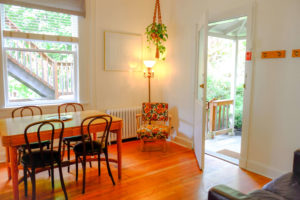 Comfortable guest lounge at Dancing Bear Inn with books and fireplace